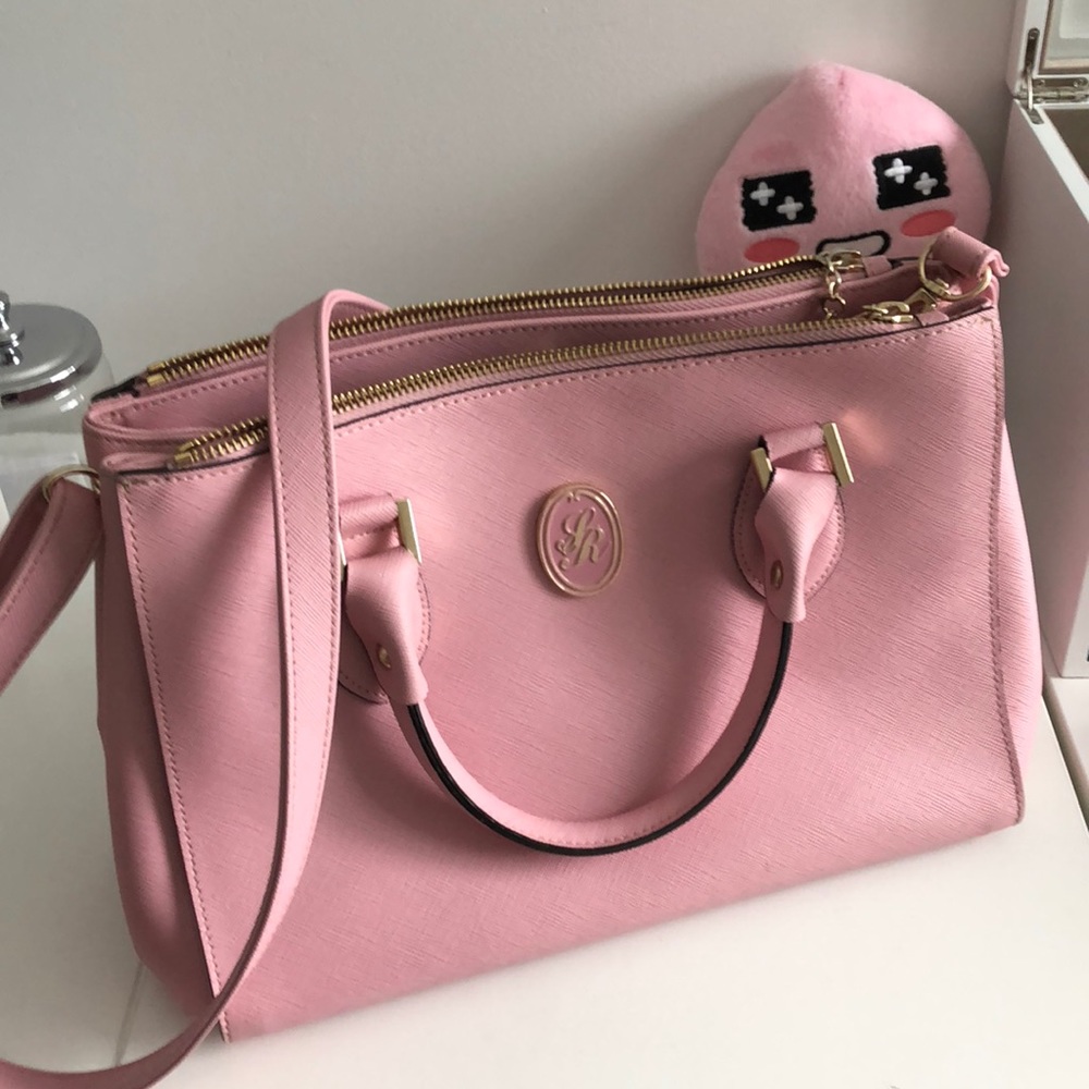Pink satchel handbag.